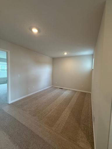 Naturally lit loft space provides a flexible area for gaming, office work, or shared play space for the little ones