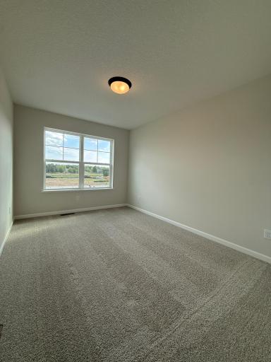 Adjacent secondary bedroom provides a bit more room, adding functionality