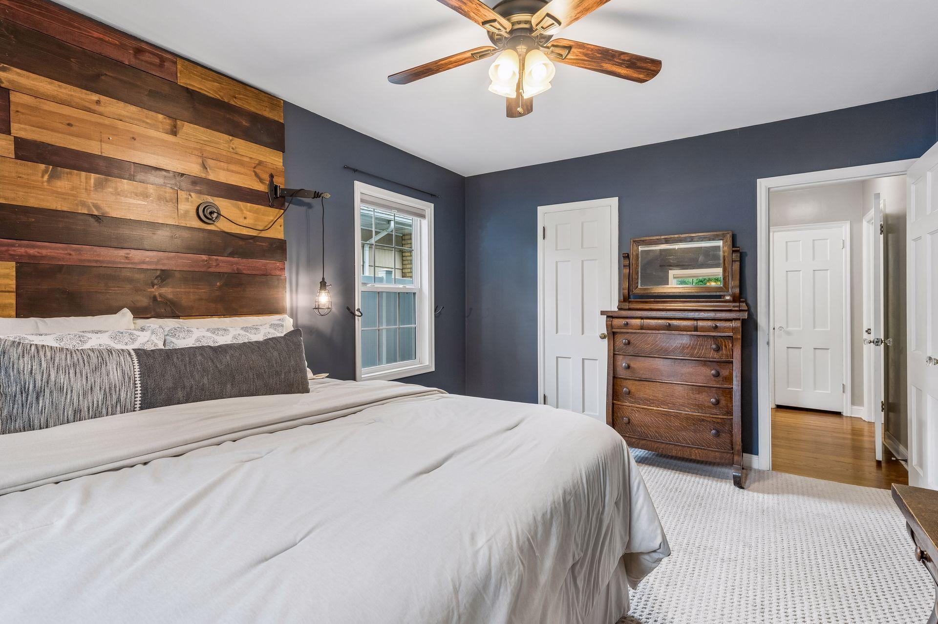 A spacious bedroom on the main level with a large closet