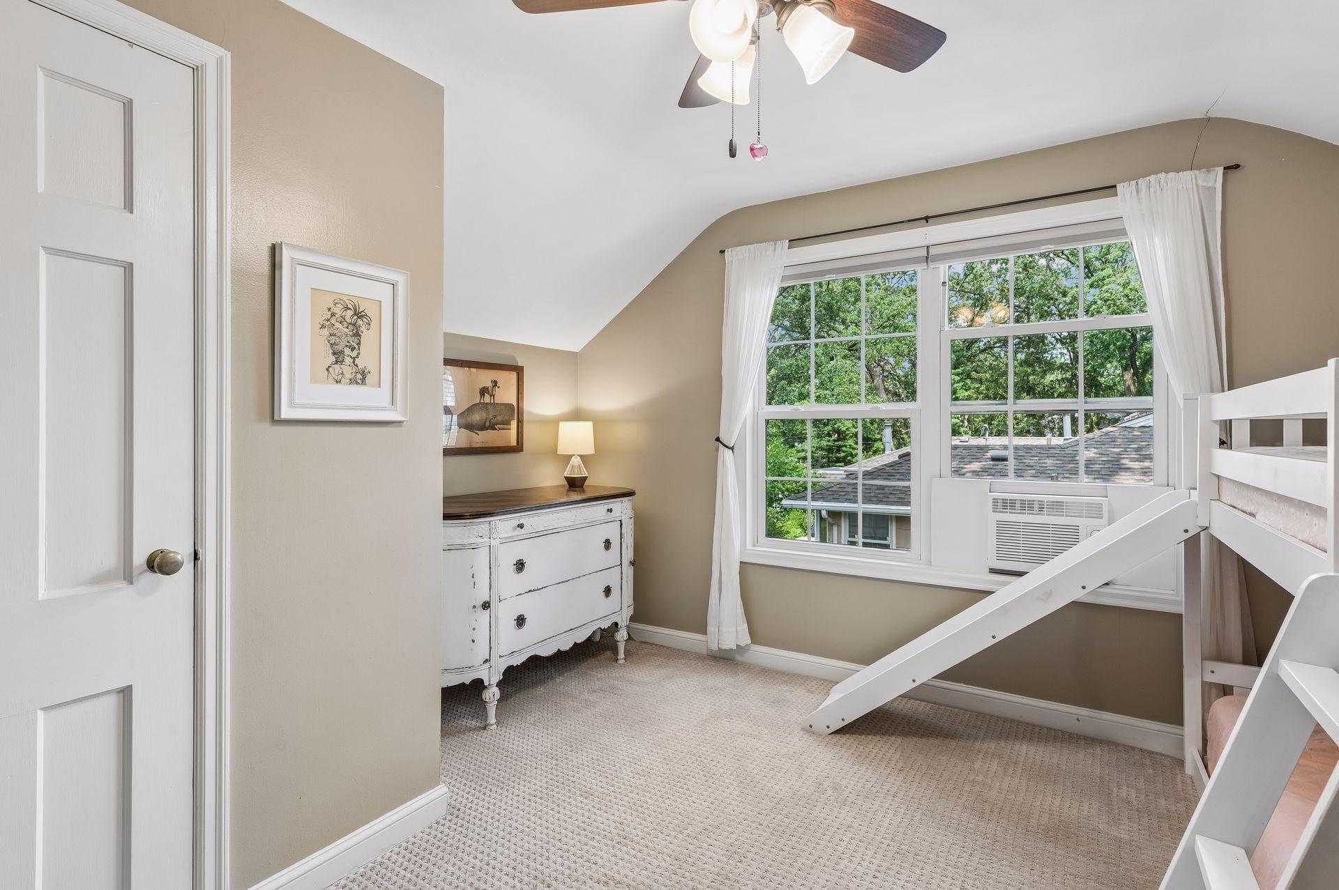 Upper level bedroom with a spacious closet