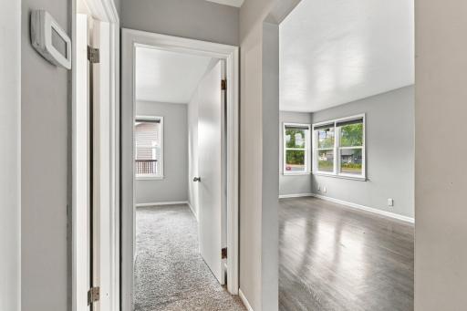 Hallway. Connects the bedroom wing to the living area, carpet in the bedrooms and hardwood in the living room.