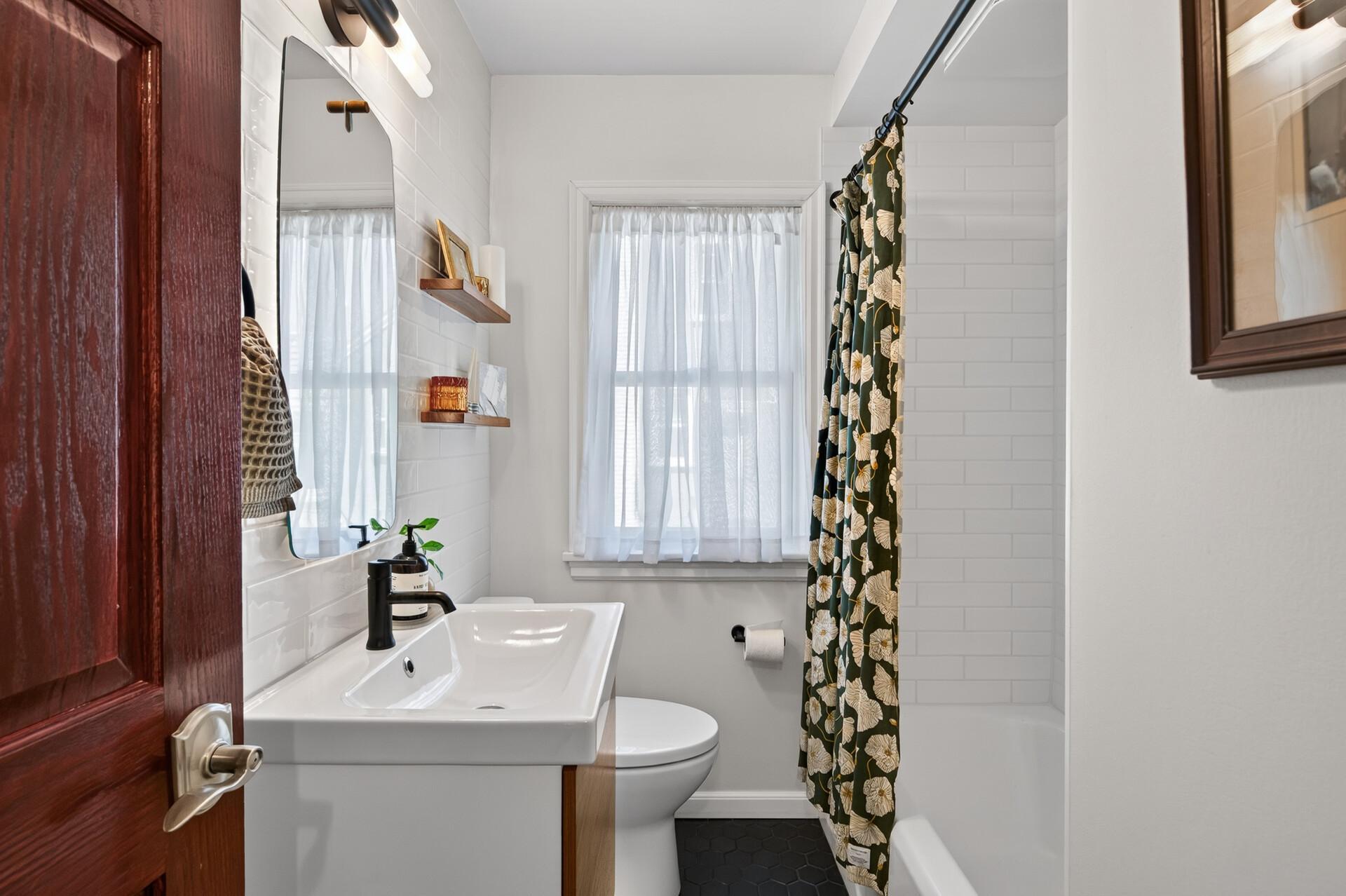 New Main floor full bath with custom tile & bath fan