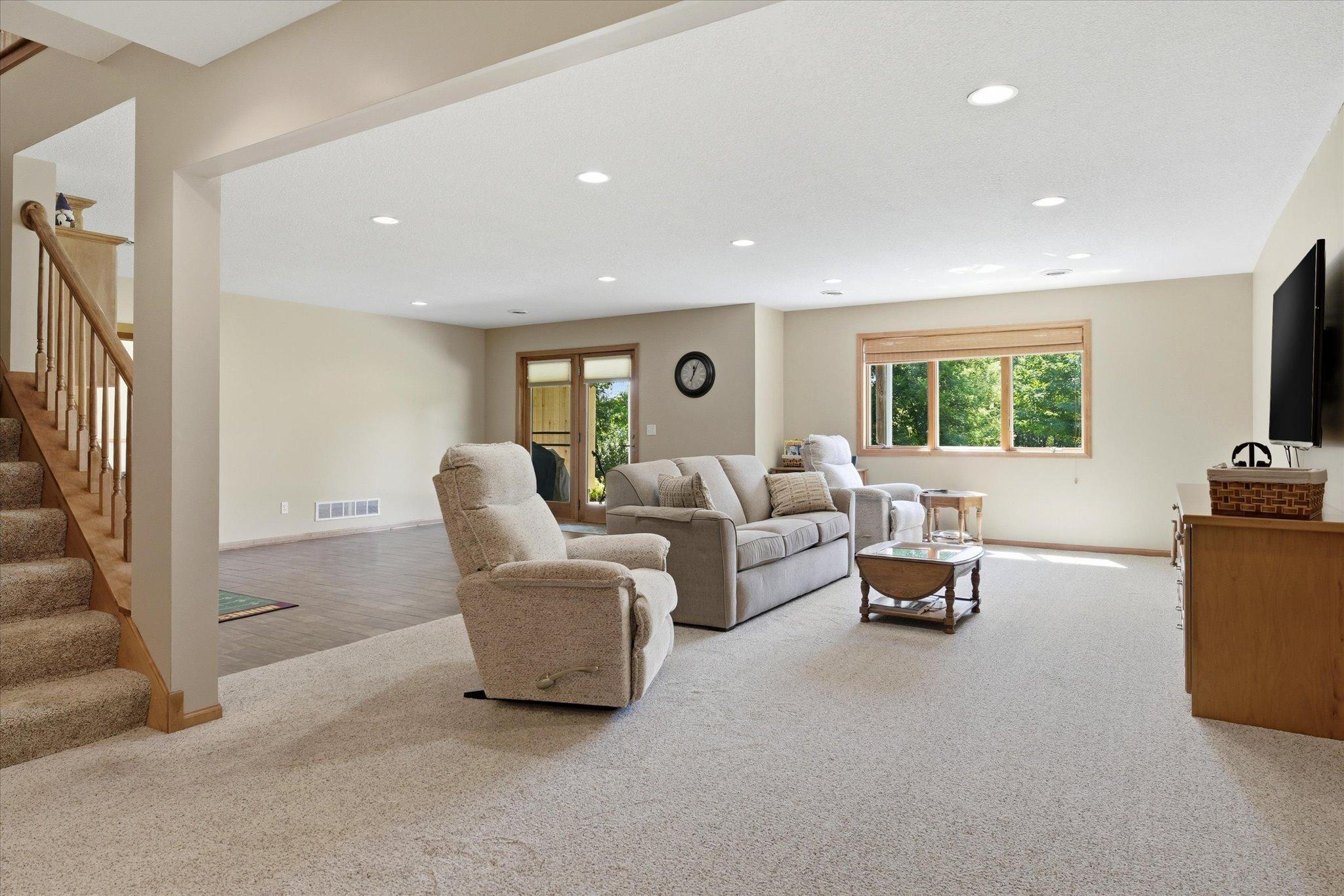 The open concept lower level has in floor heat, and lots of space for an entertainment area, recreation area and a gaming space.
