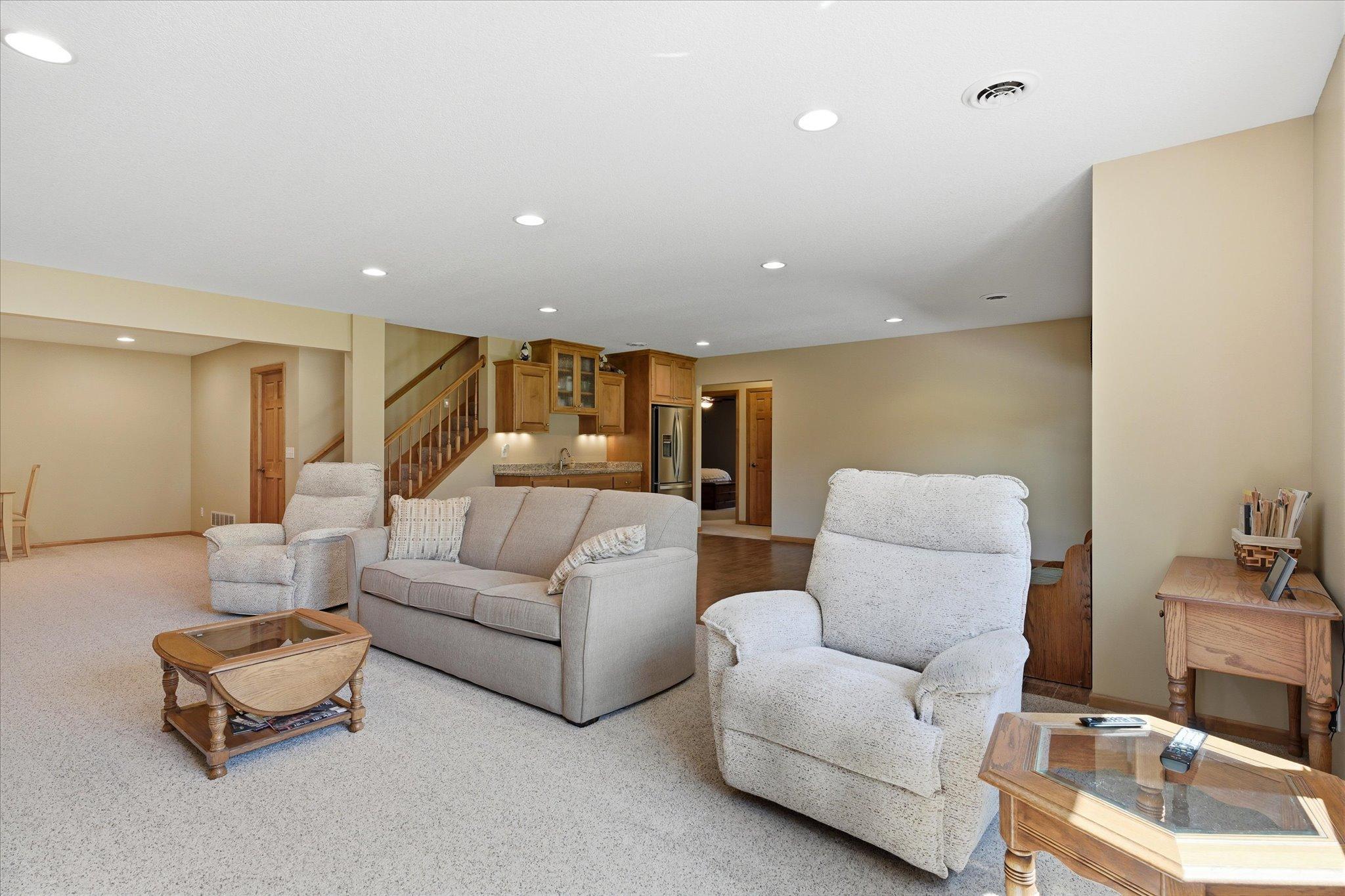 Another view of the expansive family room highlights the generous layout and seamless flow into the recreation area, making it ideal for hosting.