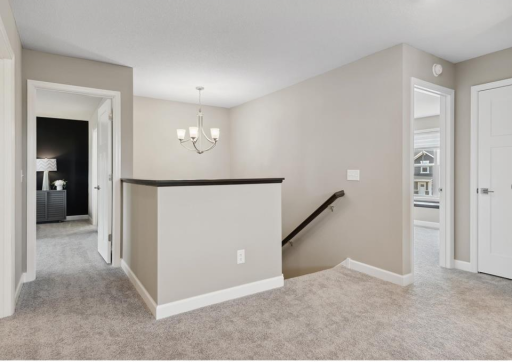 Photo is from when the home was staged as a model home - upper-level entrance from stairs.
