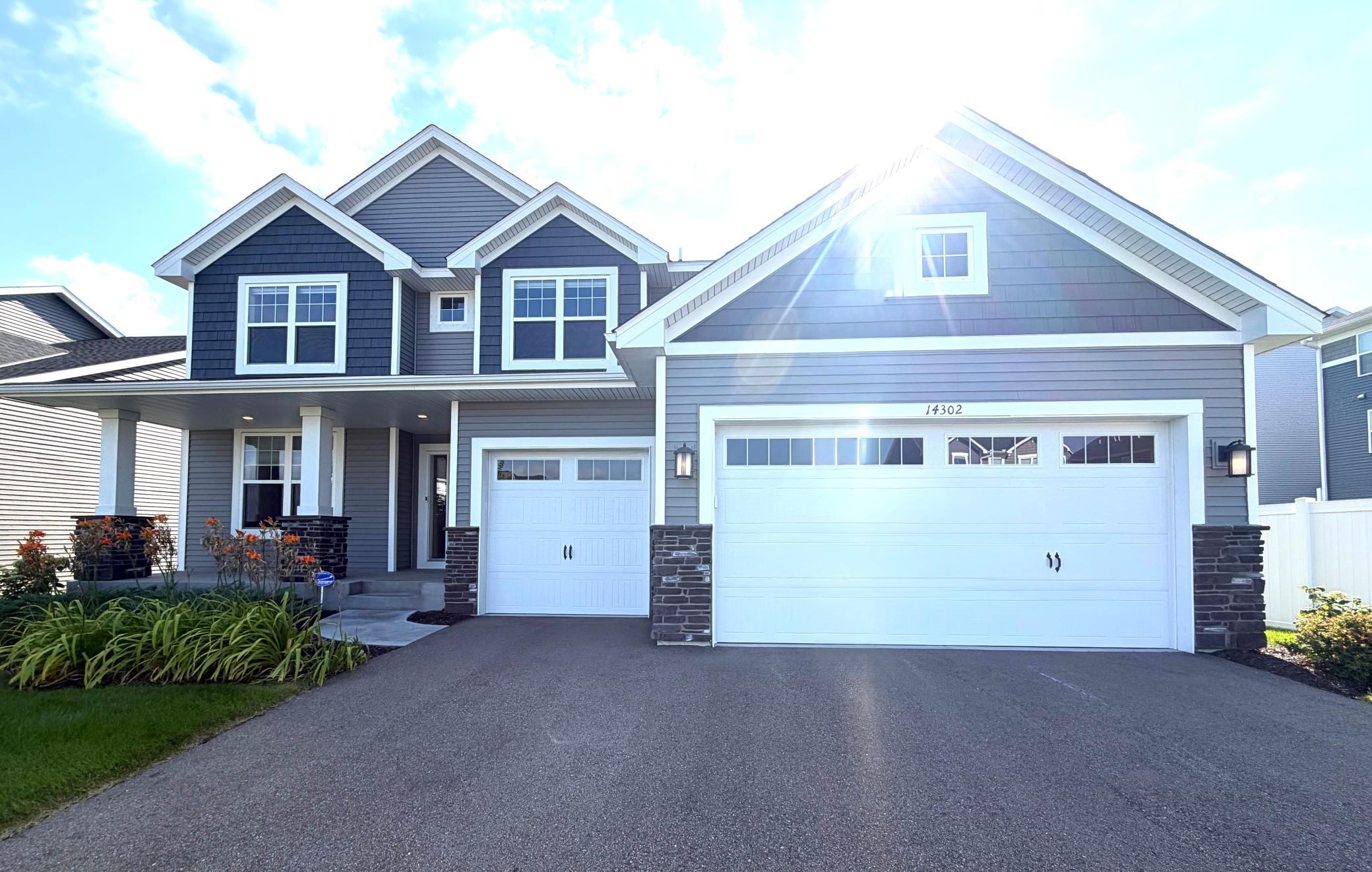 Beautiful Exterior Colors & Amazing Curb Appeal! Enjoy the large front porch! This home also has extensive front landscaping (specific to model home specifications) which includes, river rock, perennials, shrubs, a full yard of sod and irrigation!