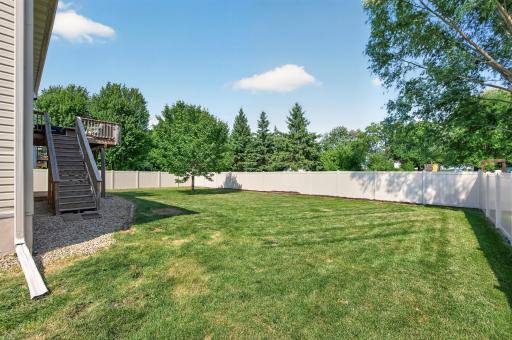 Backyard with newer vinyl privacy fence