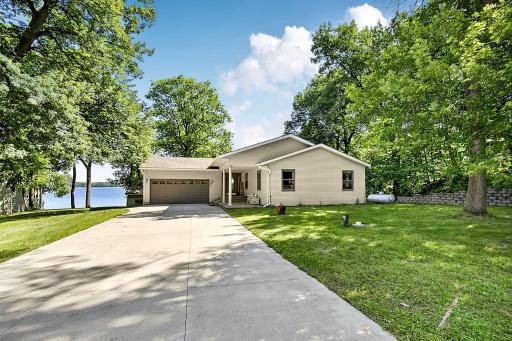 The lake is calling! Hard to find large yard with concrete driveway, 100ft lakeshore with a hard sand bottom. Come see what you've been seraching for!