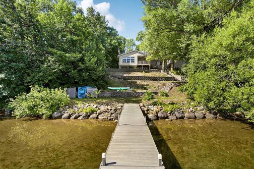 Enjoy your days at the lake with 100 ft of hard sand bottom lakeshore. There is concrete golf cart path or the stairs to access the lake.