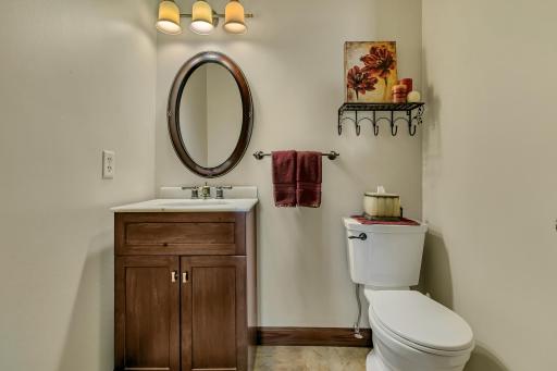 Right off of the living room you will find this convenient 1/2 bath offering tile floors.
