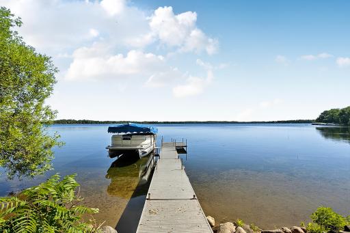The view spans across the entire lake. Beautiful hard sand bottom lakeshore with nice rip-rap shoreline. You will experience some of the best sunrises around.