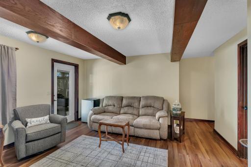 Another look at the lower level bright and spacious family room. You will find beautiful, rich woodwork throughout the home. Many updates have been made throughout he home in recent years.