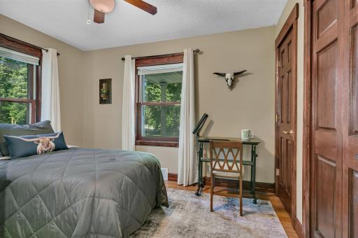 Third of four main level bedrooms offer two closets, updated flooring, and six panel doors. Large windows allow for tons of natural light.