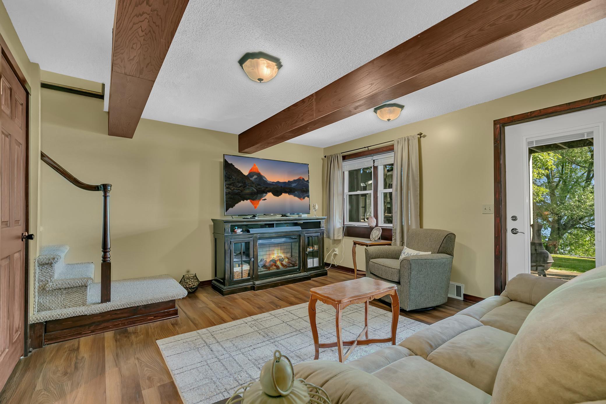 Lower level family room offers a ton of natural light, access to the patio. Tane in some of the best lake views as well.