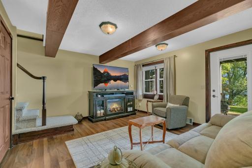 Lower level family room offers a ton of natural light, access to the patio. Take in some of the best lake views as well.