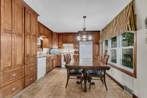 Beautifully updated eat in kitchen offering granite counter tops, plenty of storage, tile floors and some great lake views.