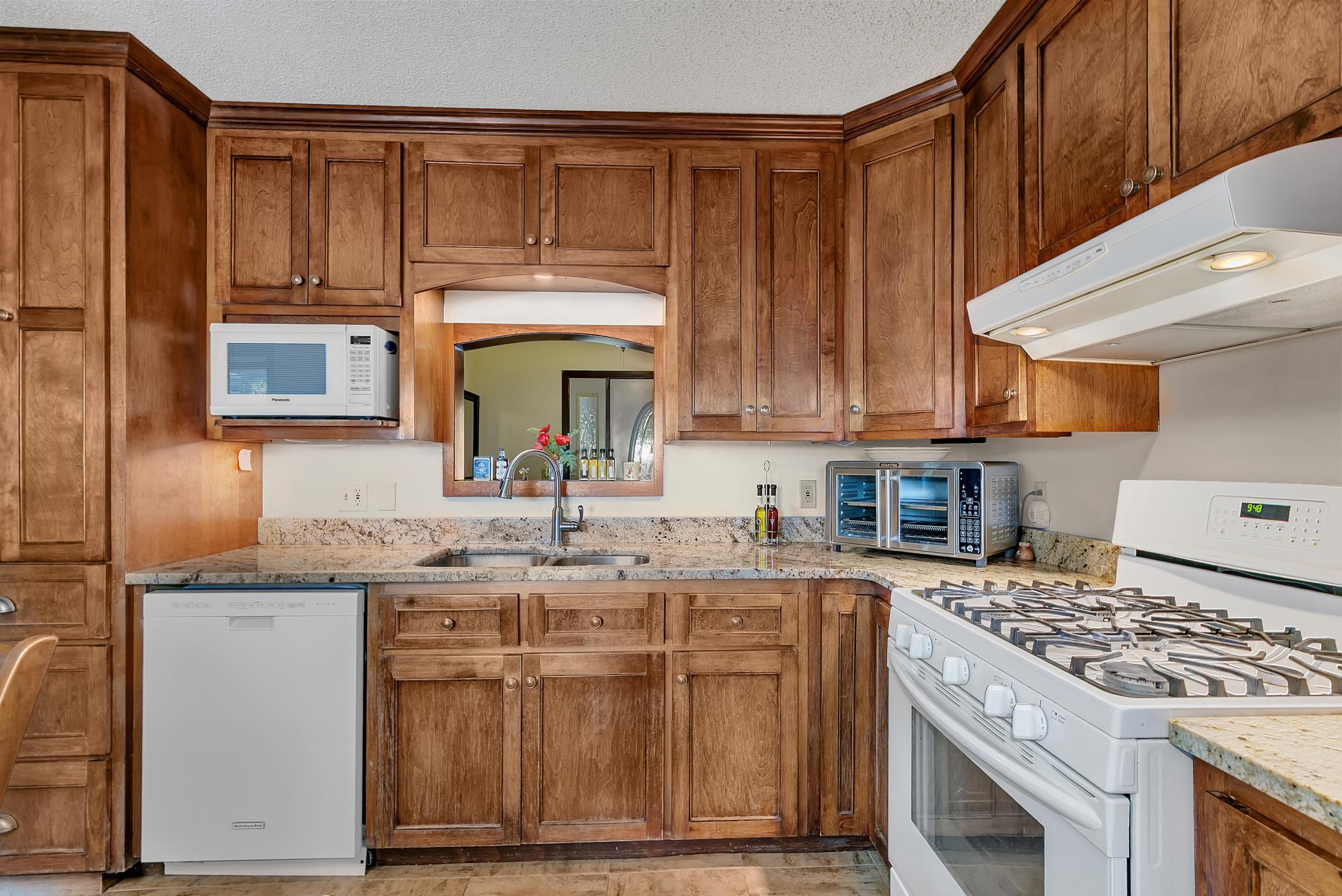 Another view of the kitchen looking towards the foyer. Love the cabinets!