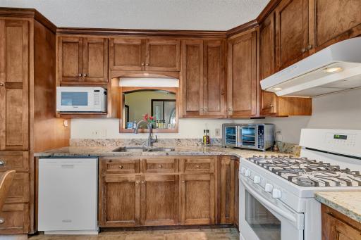Another view of the kitchen looking towards the foyer. Love the cabinets!