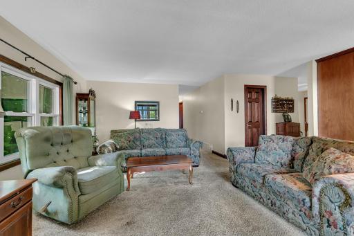 View of the living room looking towards the hallway & foyer area. Hallway leads to 4 bedrooms and a full bath. This home is a must-see to fully appreciate.