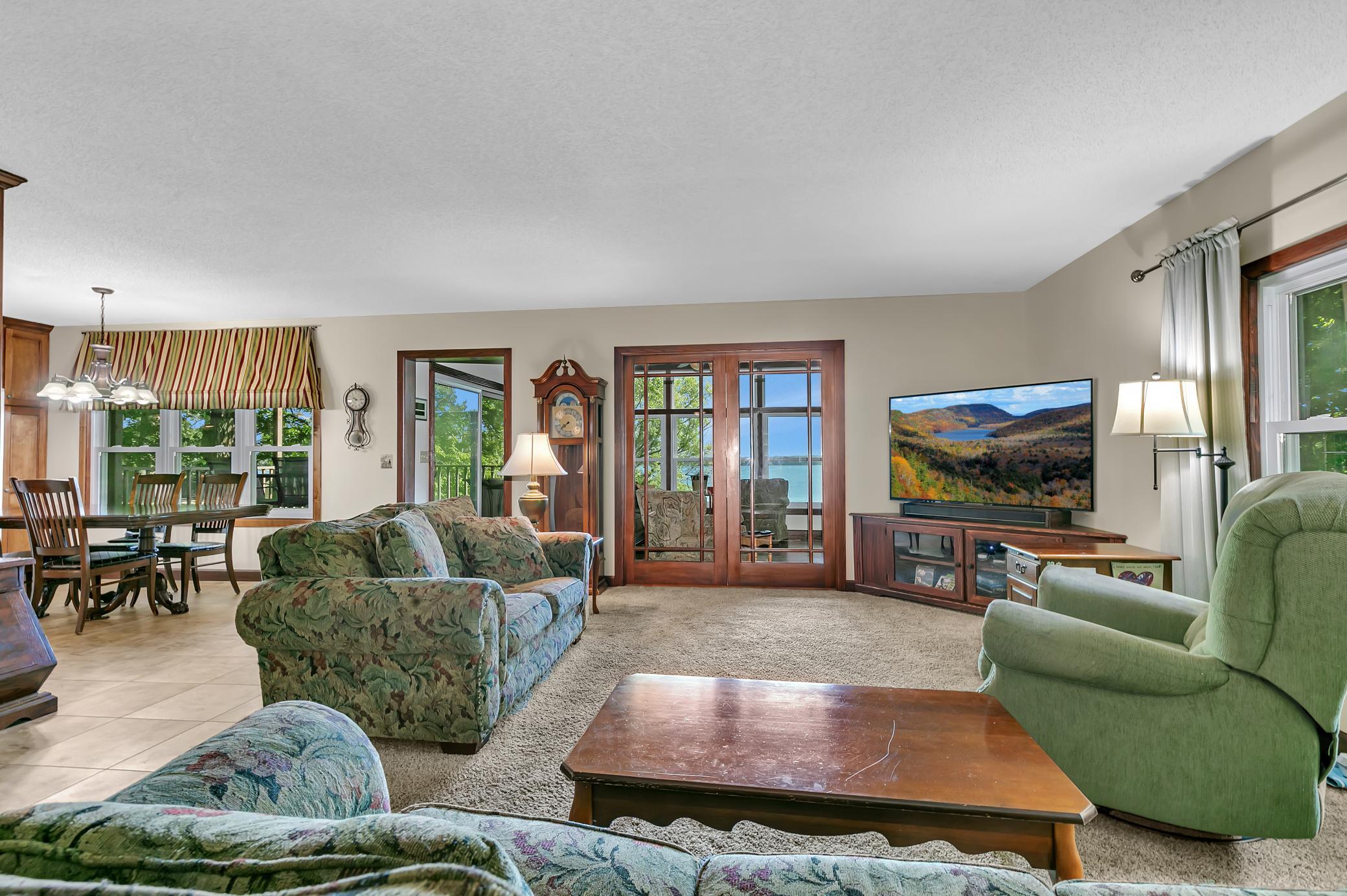 How much fun would it be entertaining in this space? This large living room opens to the porch to allow both rooms to flow as one. This open concept home has it all!