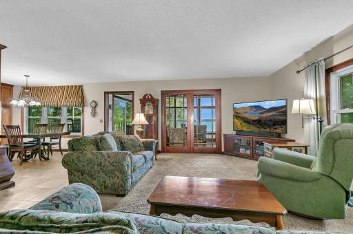 How much fun would it be entertaining in this space? This large living room opens to the porch to allow both rooms to flow as one. This open concept home has it all!