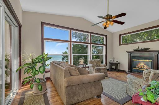 Cozy up with the fireplace and enjoy fantastic views! This space offers floor to ceiling windows, hardwood floors, and gas fireplace.