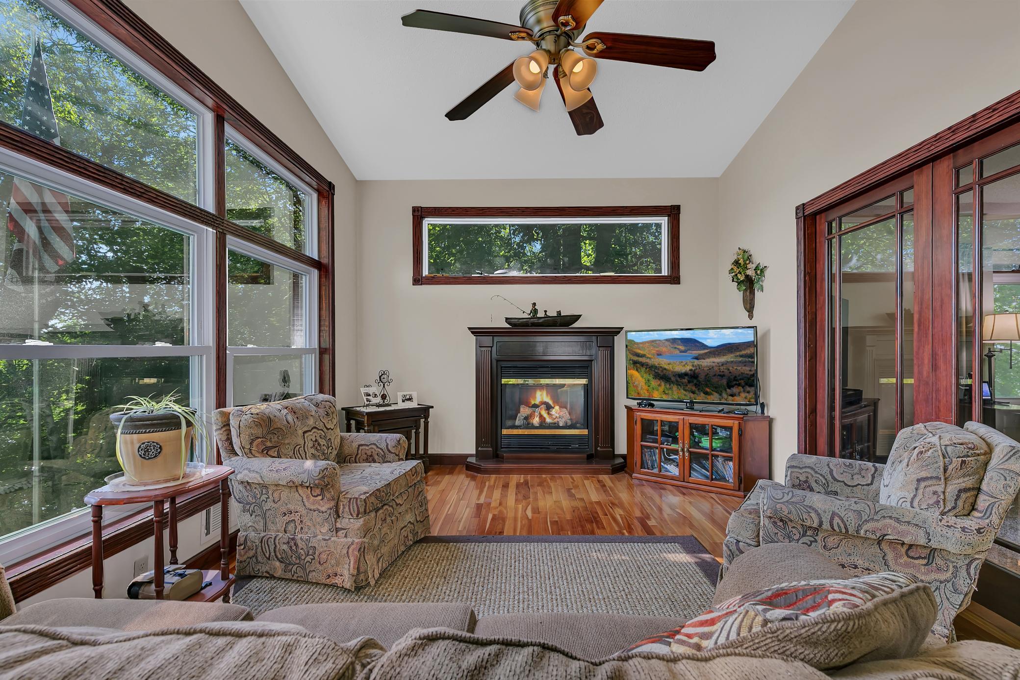 Another angle of the porch. This space offers so much natural light, access to the deck and french doors that lead to the living room.
