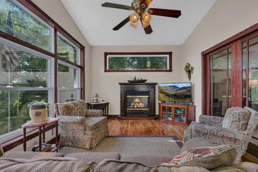The 4 season porch offers the best lake views, gas fireplace, so much natural light, access to the deck and french doors that lead to the living room.