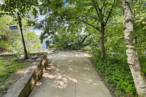 Concrete path to the lake is gradual and makes for effortless lake access. This path works well for a golf cart also.