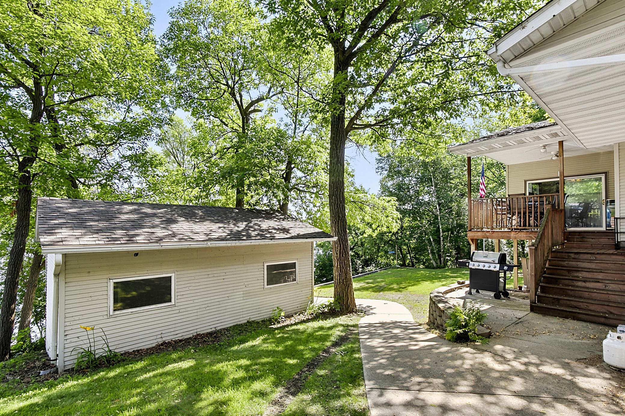 Sidewalk leading to the spacious and open back yard.