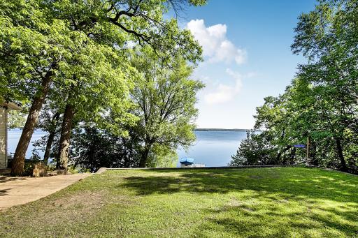 This level area in the back yard is great for yard games or bon fires and offers some of the best lake views around! There is a great amount of landscaping that has been done to create this great level space.