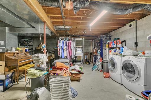Basement laundry room also double as a huge storage area. This area may have potential to be finished and made into a more usable space. Bring your ideas!
