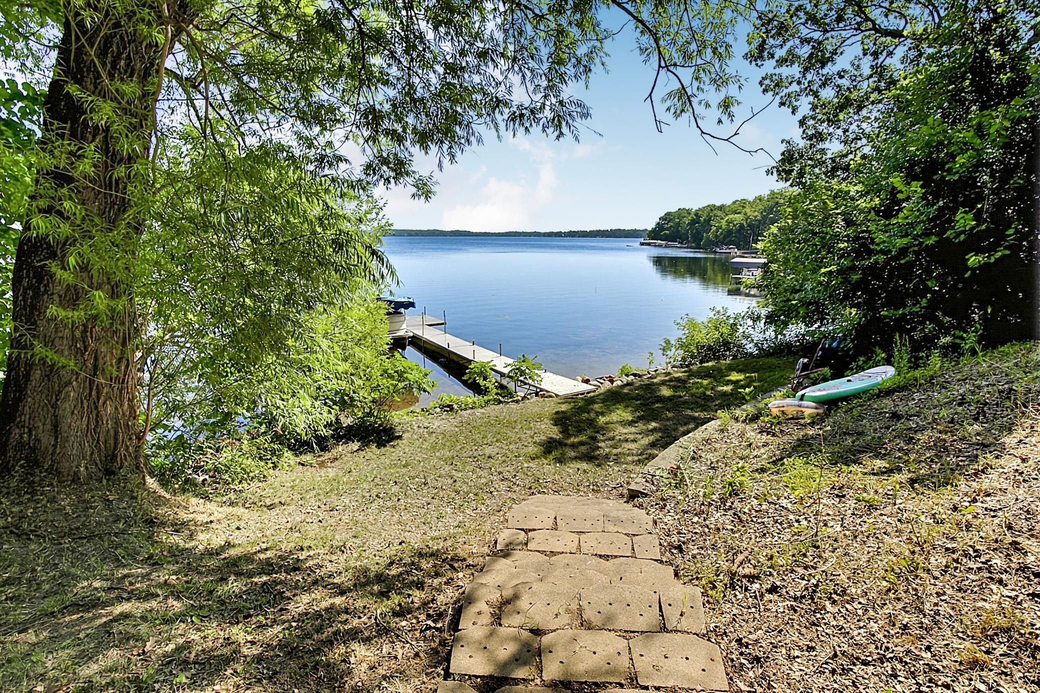 Steps to the lake or to the left of them you can drive your golf cart right down to the water's edge.