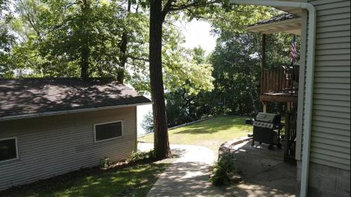 Concrete path leading to the backyard. There is also a concrete path leading most of the way to the lake. Come see what can be yours!