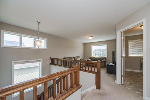 The upper level of this home includes four bedrooms, two bathrooms, the laundry and a bonus room!