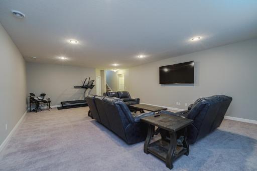 The family room has 9-foot ceilings, recessed lighting, and full-sized daylight windows.