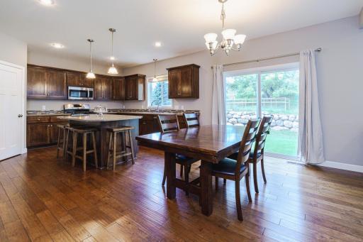 The kitchen opens to a spacious dining area that leads to the backyard, which is ready for a future patio.