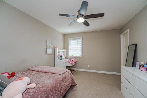 This is one of four upper level bedrooms. They have ceiling fans and deep closets.