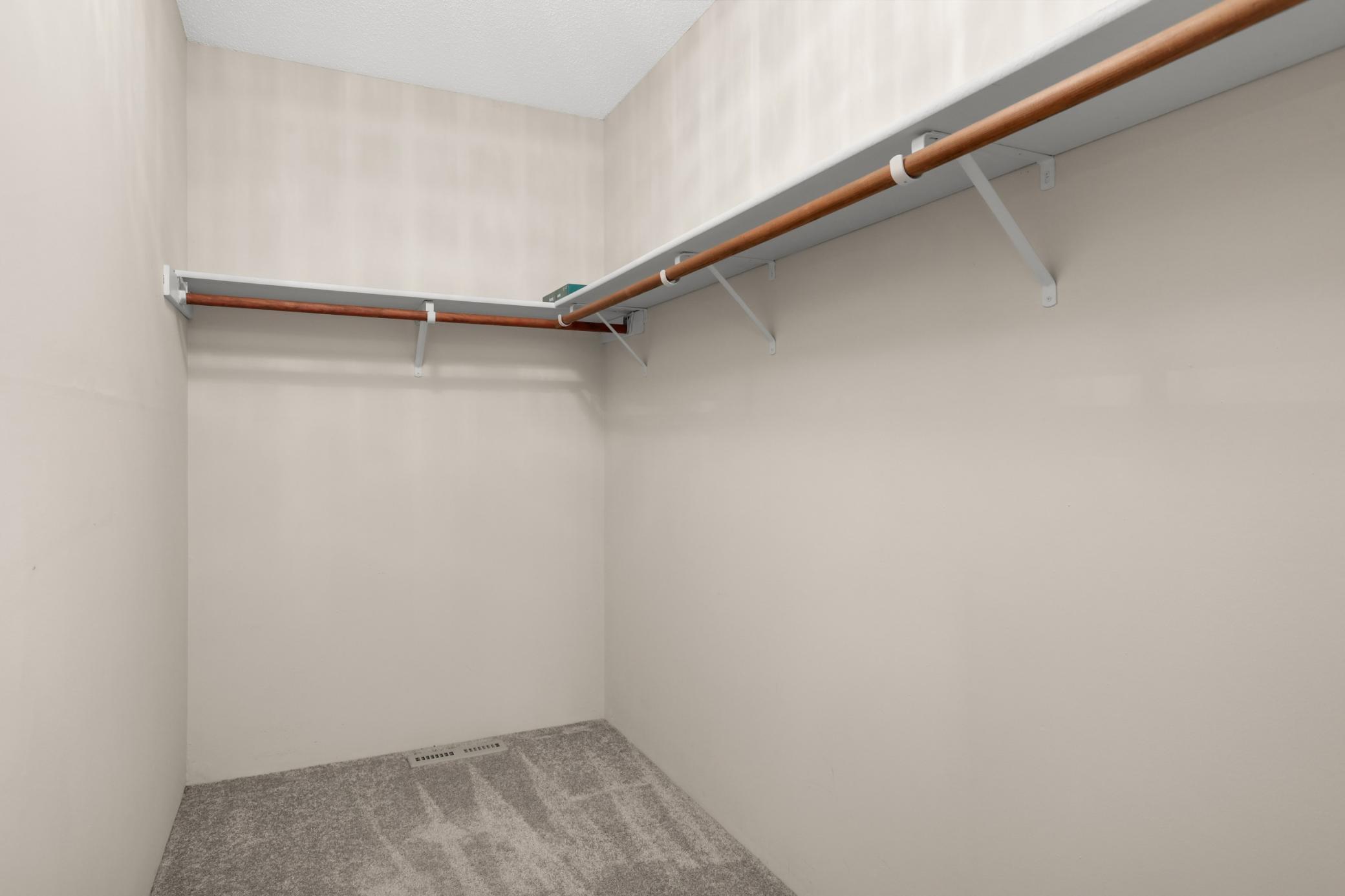 Primary bedroom walk-in closet.
