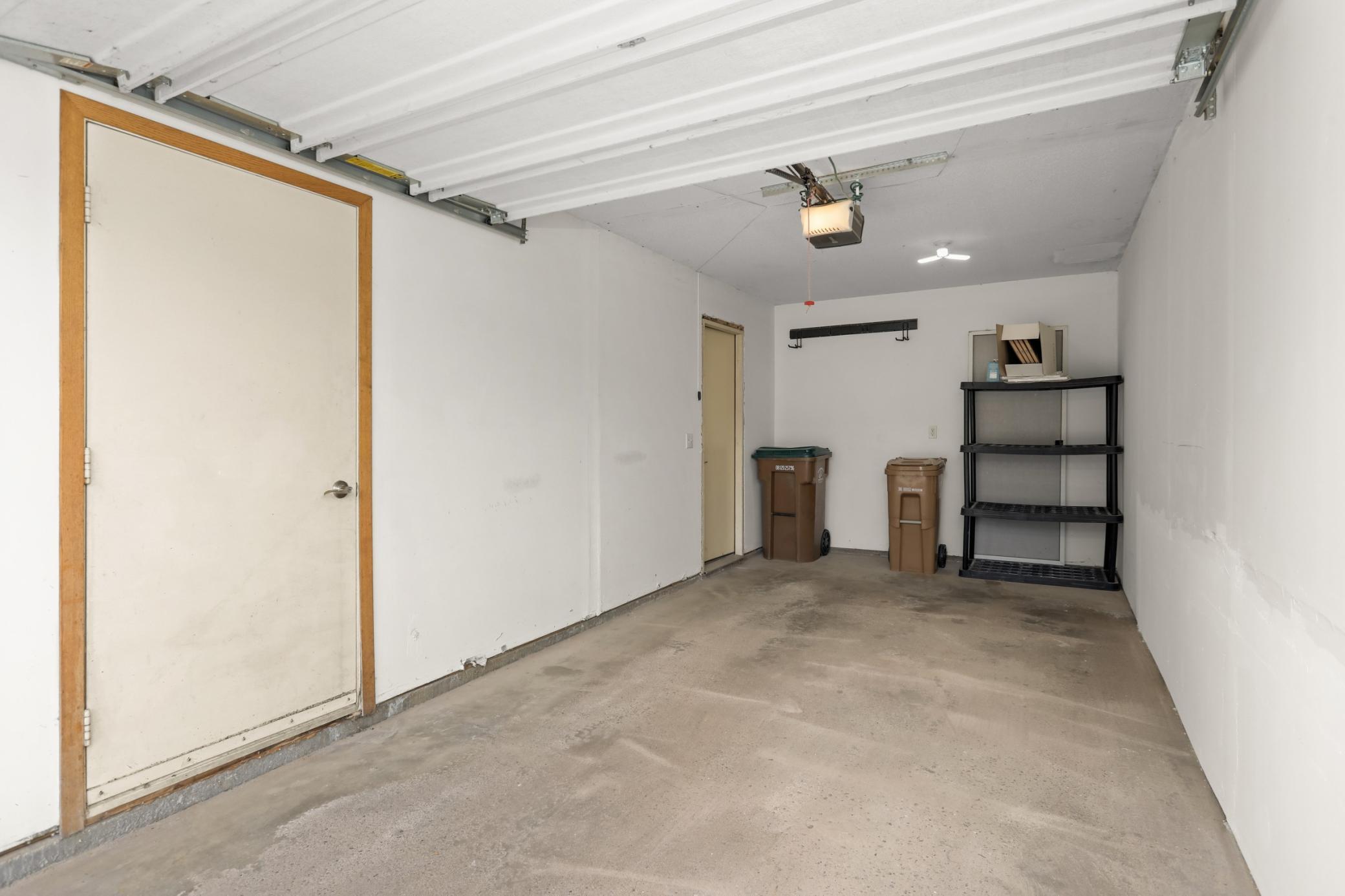 The garage is an oversized one stall. The mechanicals are located behind the first door on the left. The entry door is in the back of the garage.