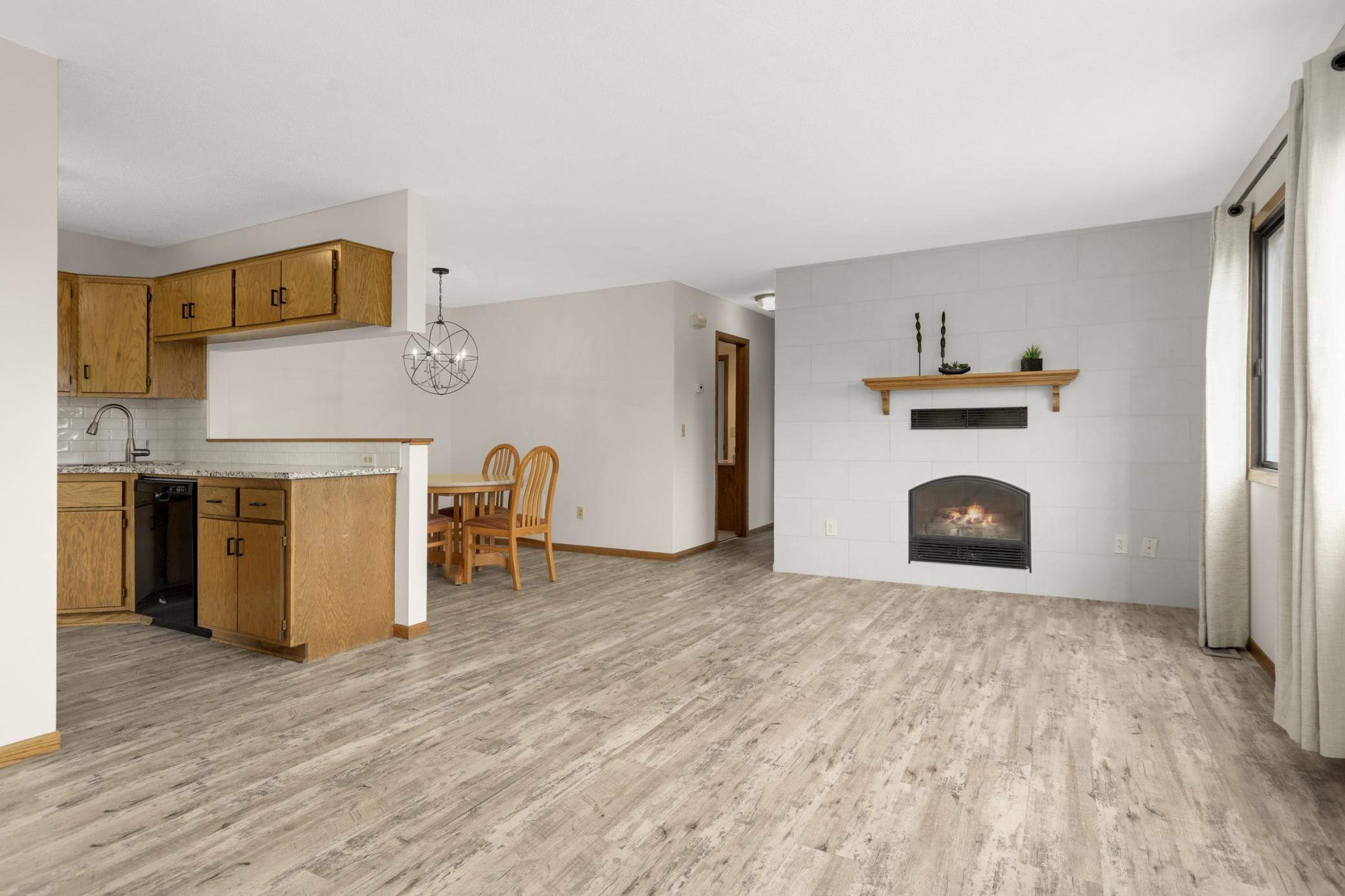 The gas fireplace is a bonus! This view is from the steps as you enter. All living spaces are one one level.