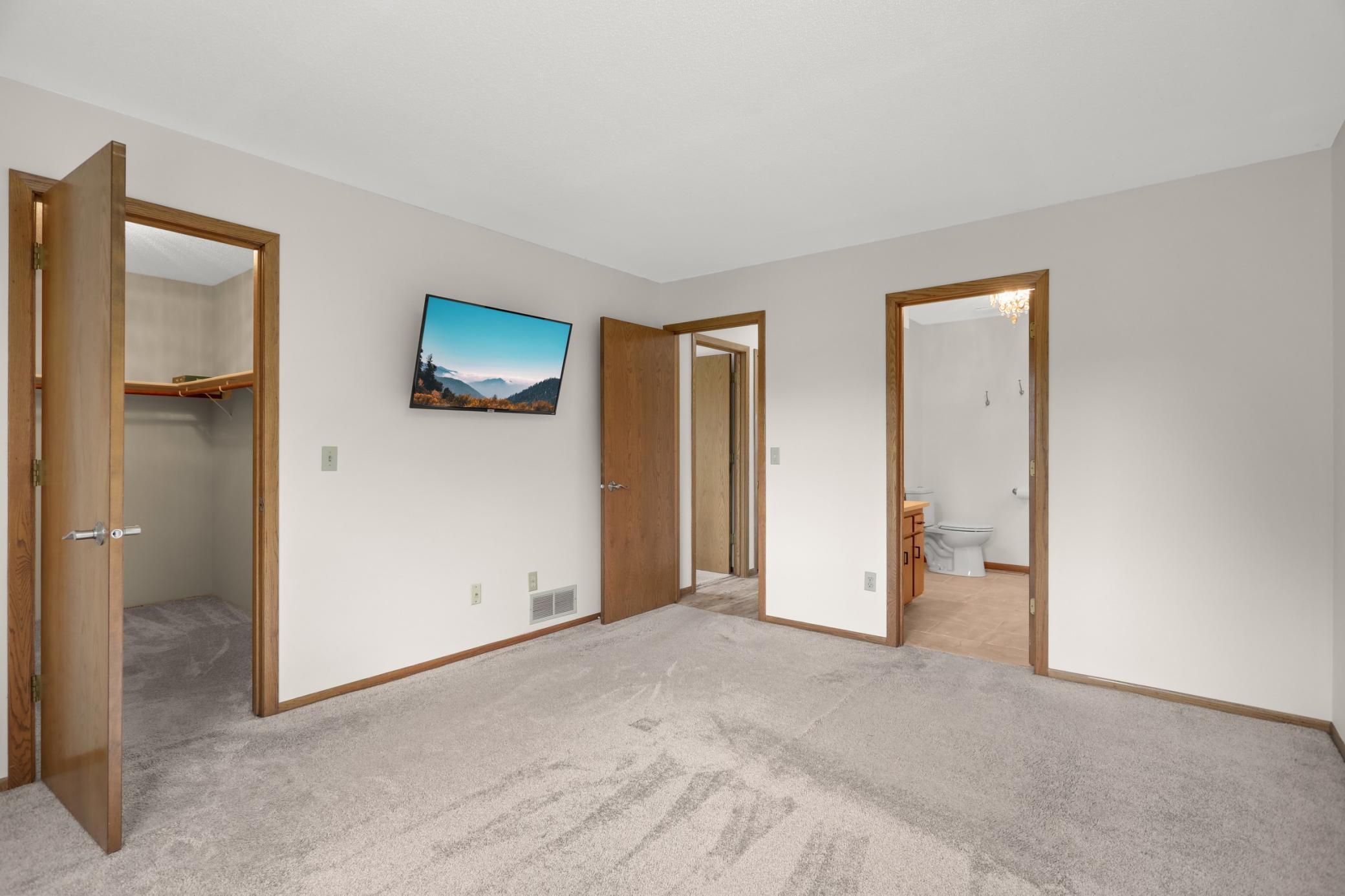 The primary bedroom has a walk in closet and direct access to the bathroom.