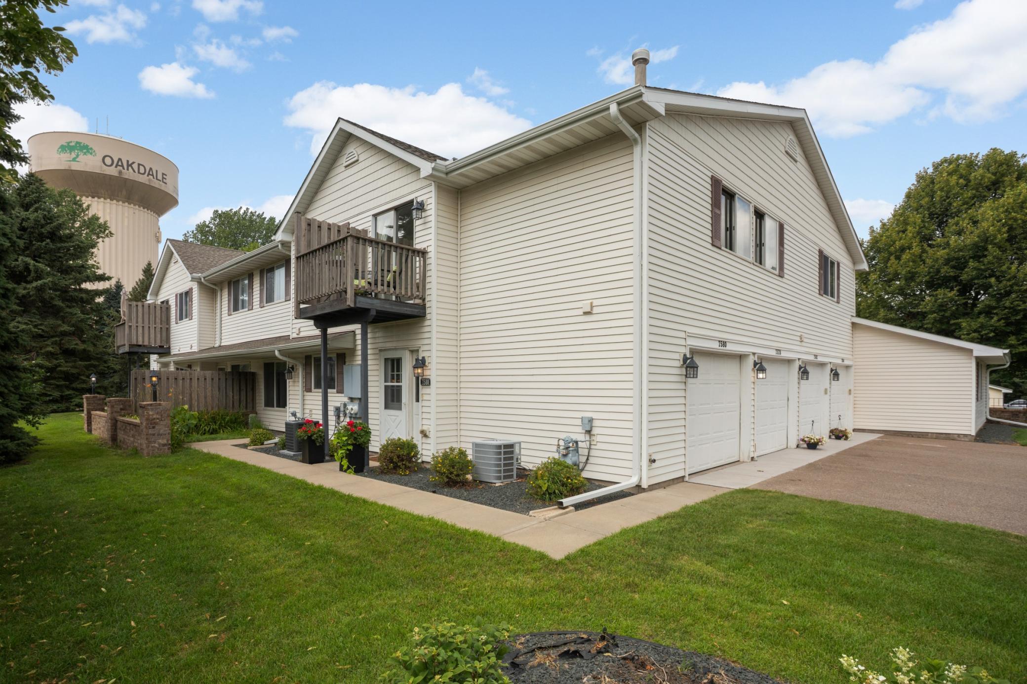 Well maintained townhouse on a corner lot. The balcony overlooks the green space.The garage is the first one on the left. It also has interior access to the home.