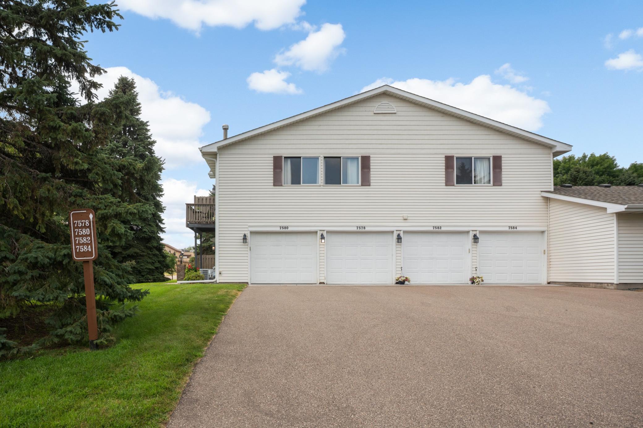 The first garage door to the left belongs to this townhouse. 7580 13th St N