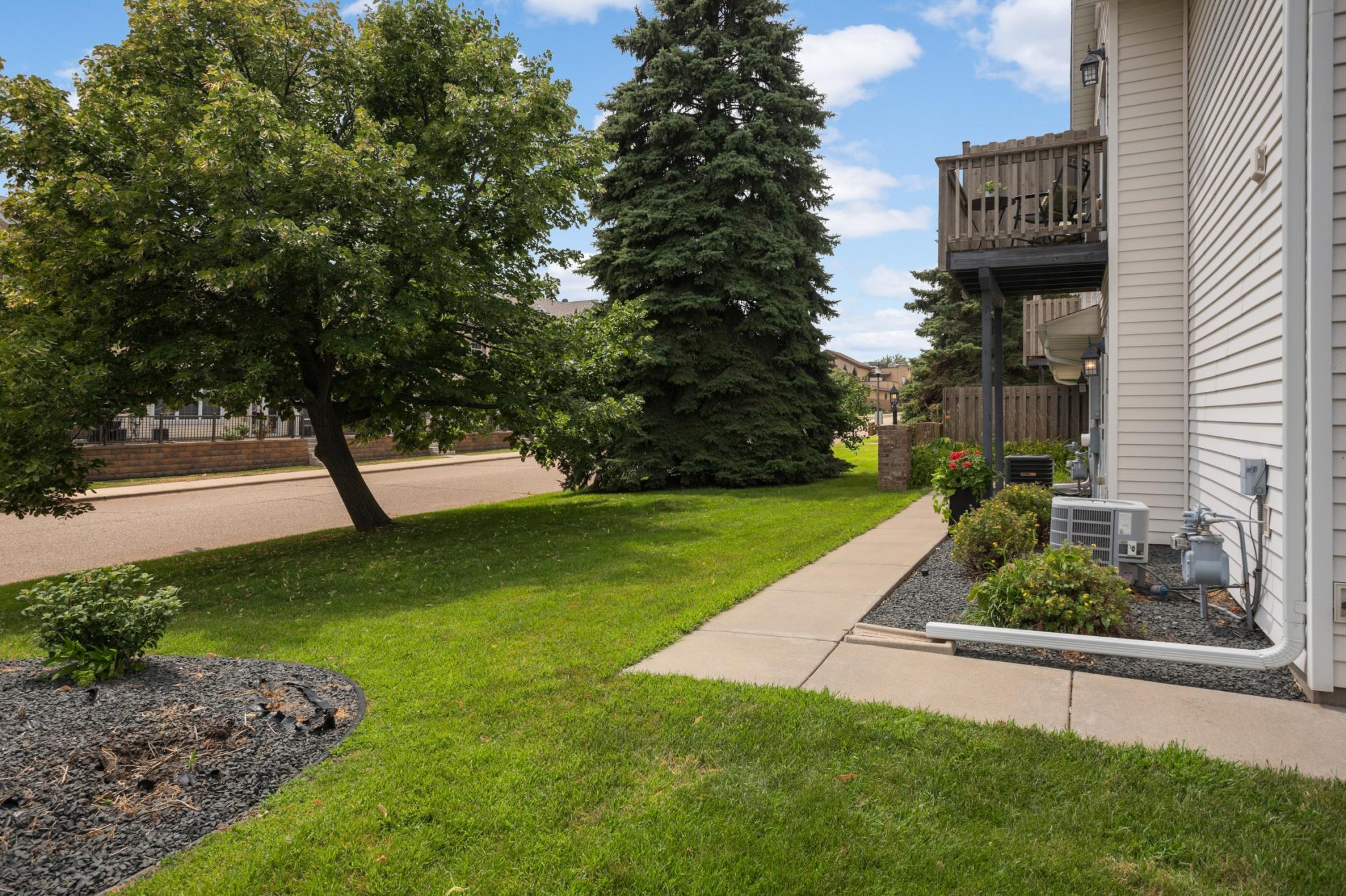 Sidewalk leading to the front door.