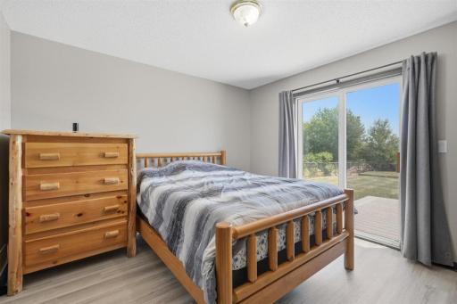 Primary bedroom with access to the deck outdoors