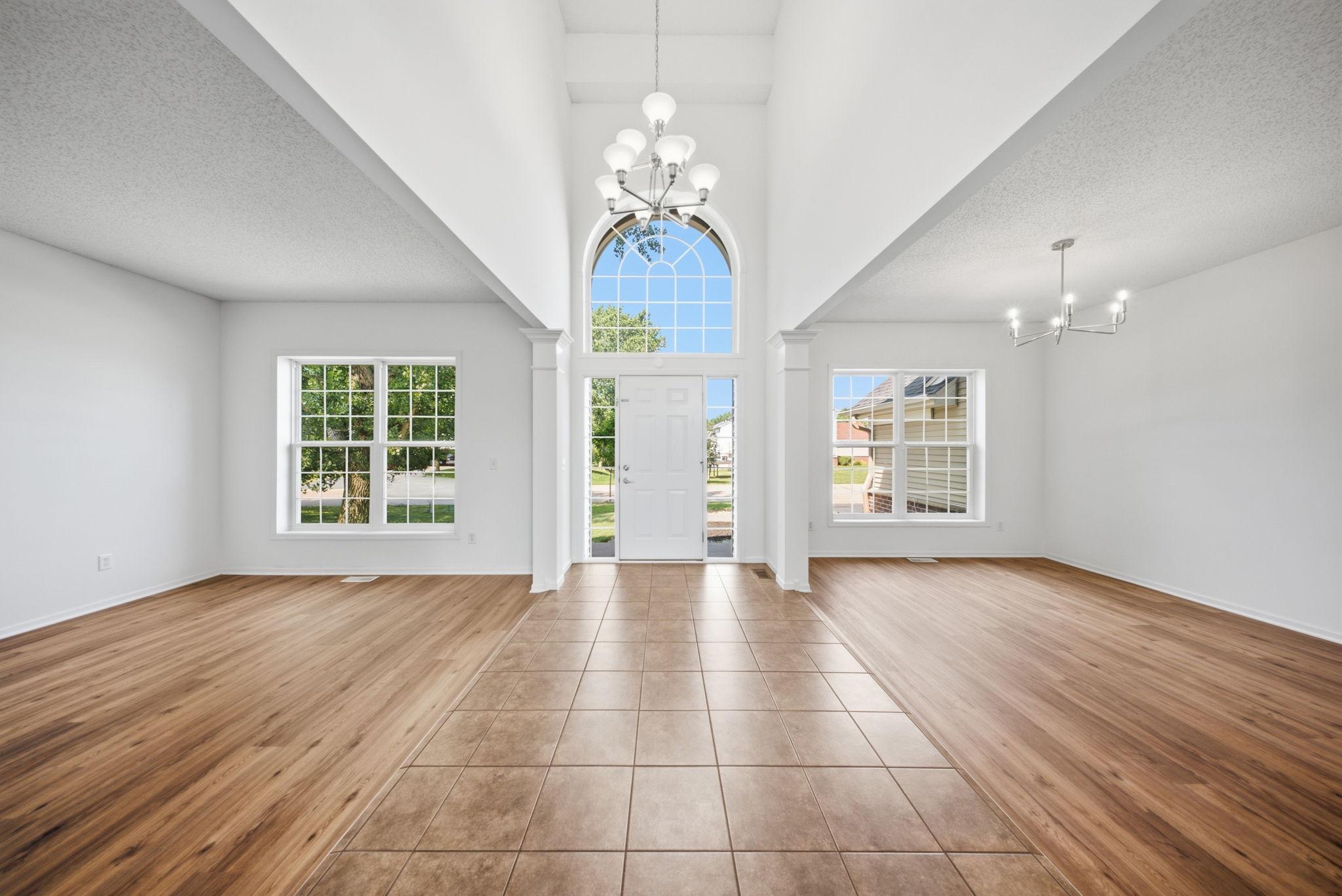Step inside to a vaulted foyer and living and dining rooms.