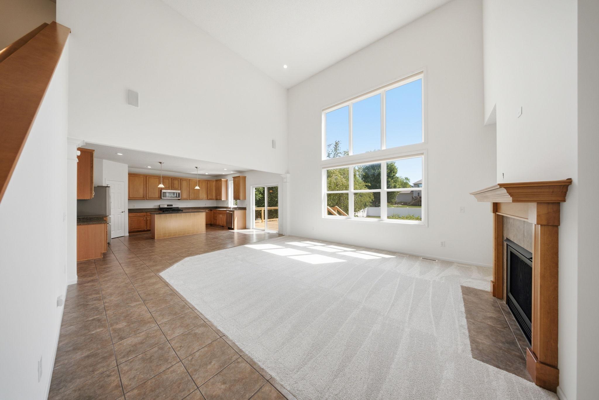 Gorgeous vaulted two story family room with open concept kitchen.