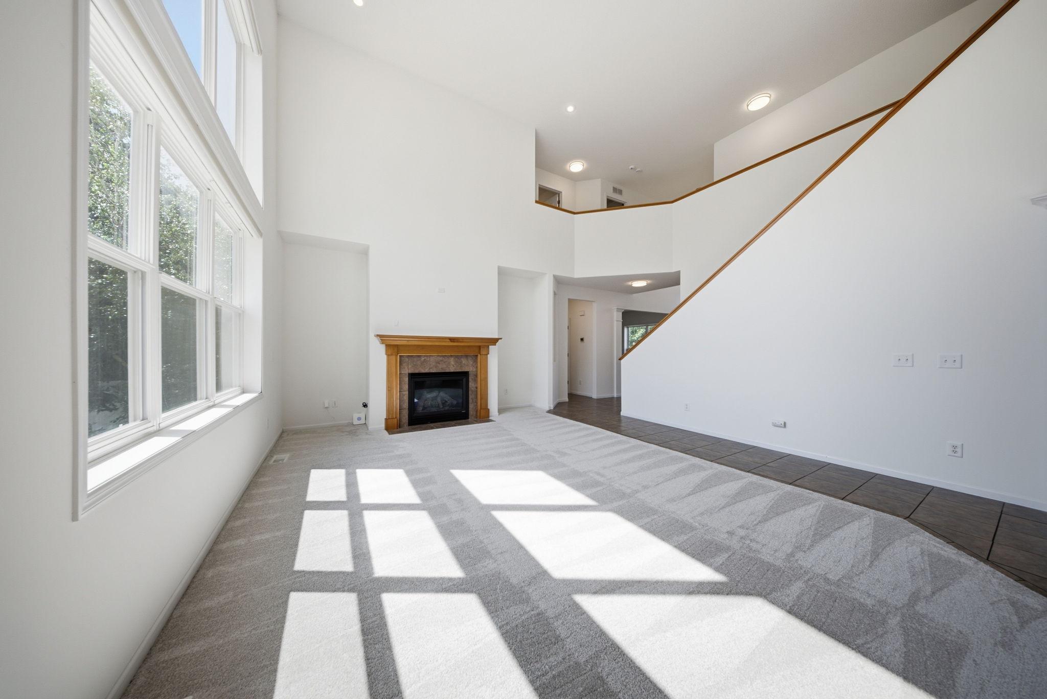 Dramatic two story foyer with full wall of windows overlooking the backyard!