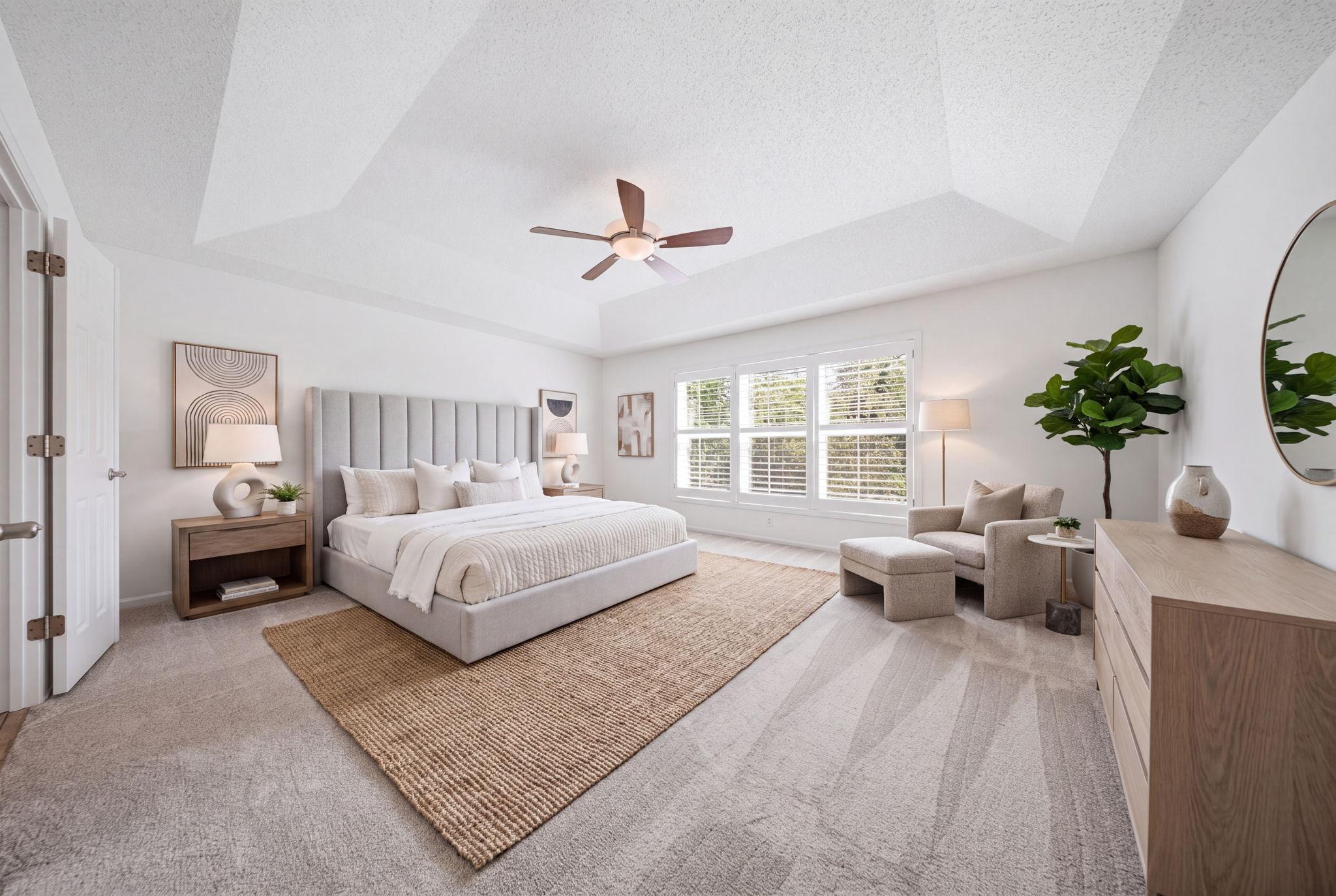 Expansive primary suite, virtually staged.